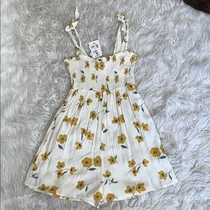 Never worn romper! Still has tags on!